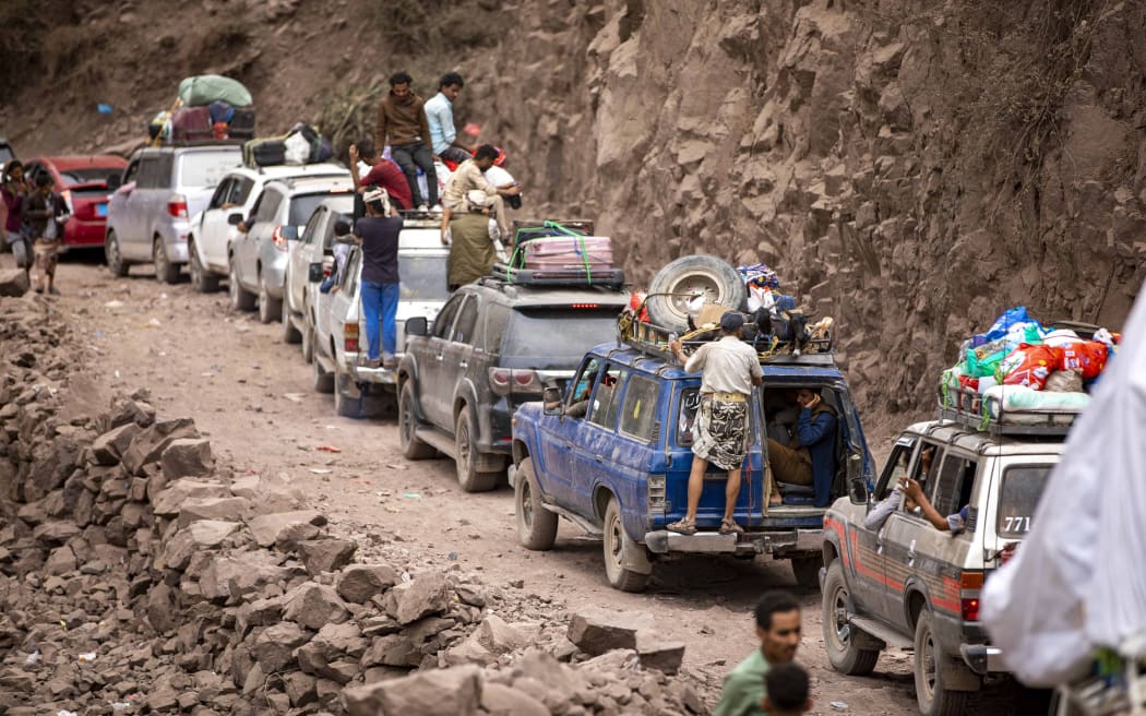 Traffic on a heavily damaged narrow road that serves as a lifeline between the disputed Taiz and the southern port of Aden, on July 8, 2022.