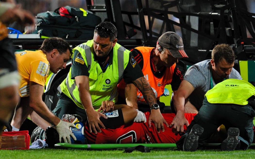 The Crusaders' Reed Prinsep is treated after suffering a concussion.