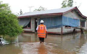 Red Cross staff checking on people flooded out in Samoa.