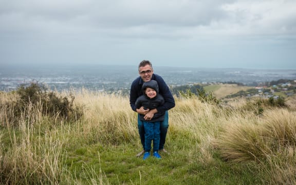 Sean Scanlon with his son in the Port Hills