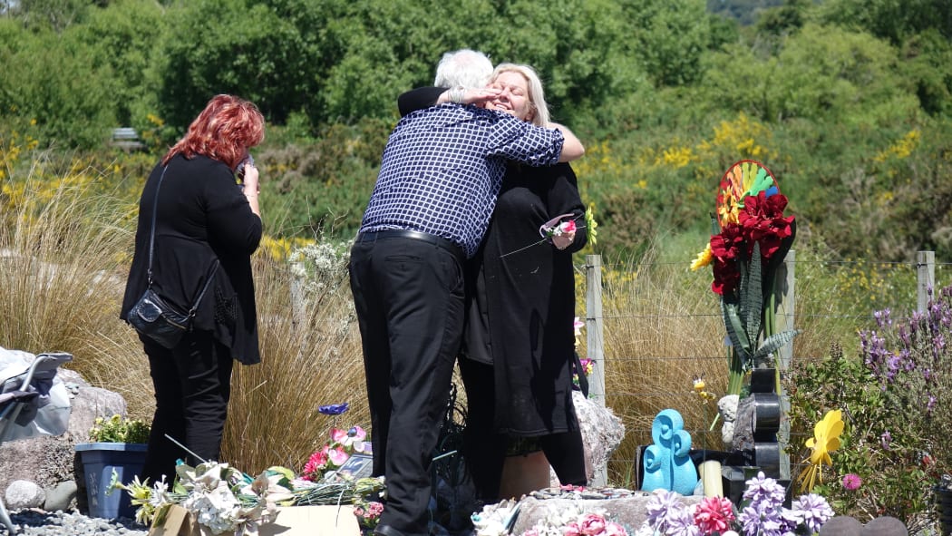 Sonya Rockhouse receives a hug from Bernie Monk at a memorial site for 29 men near the turnoff to the Pike River Mine. 
 


CONAN YOUNG / RNZ