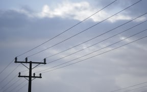 Powerlines on a cloudy sky