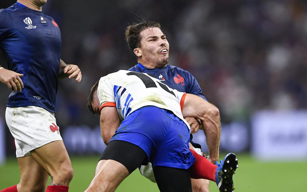 France's Antoine Dupont is tackled by Johan Deysel of Namibia.