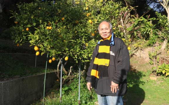 Muagututi'a Aliota HarryTauafiafi enjoying his lemon tree at home in Newlands