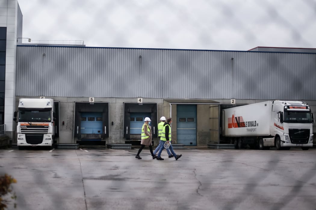 Trucks are loaded at a factory of US multinational pharmaceutical company Pfizer in Puurs, Belgium, where Covid-19 vaccines are being produced for Britain. 3 December 2020.