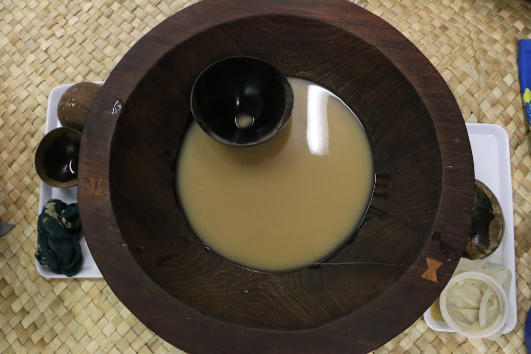 A tanoa (kava bowls) with a bilo (kava cup). Normally the lowliest person would serve kava to the circle.