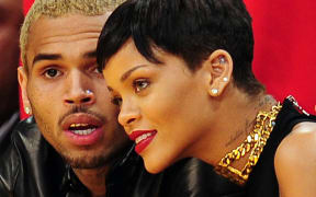 Rihanna and Chris Brown attending a basketball game in Los Angeles in 2012.