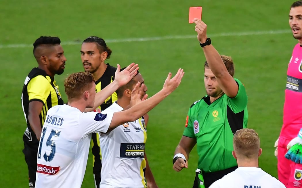 Mariners' Kye Rowles (L) is red carded during the A-League game against Phoenix.