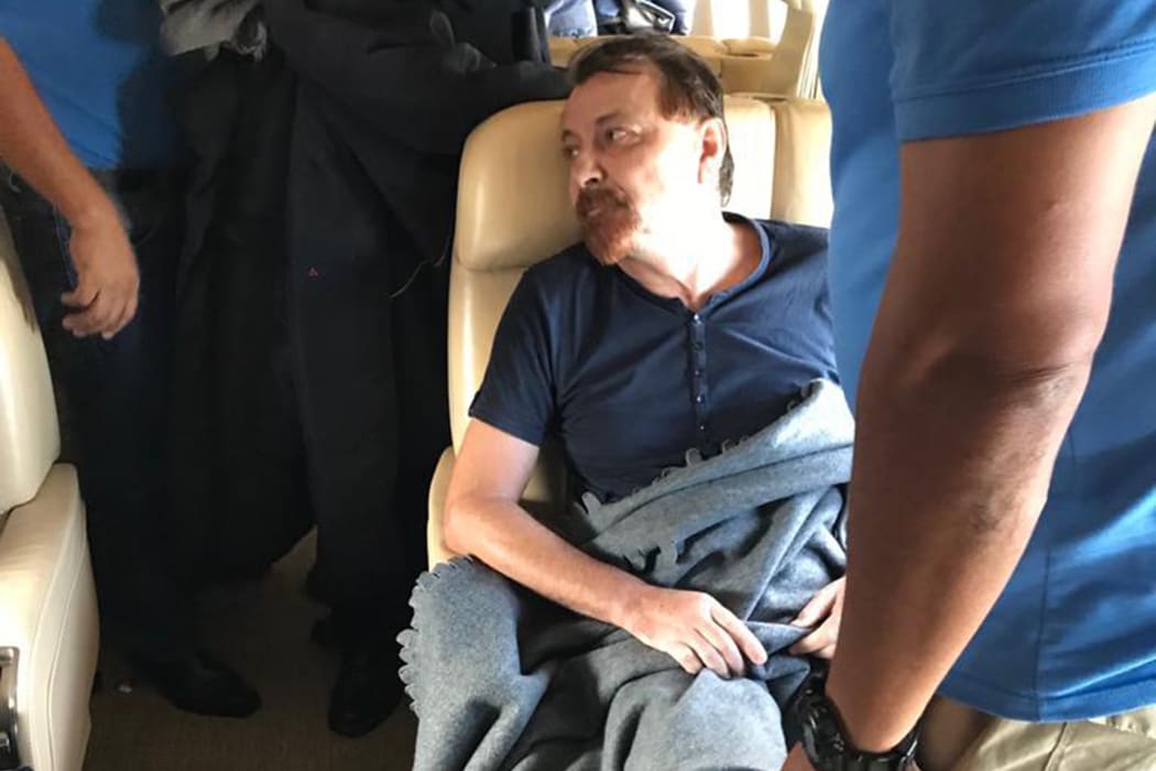 Former far-left Italian militant Cesare Battisti sitting aboard a plane chartered by the Italian governement, prior to taking off from Santa Cruz de la Sierra, Bolivia, on January 13, 2019.