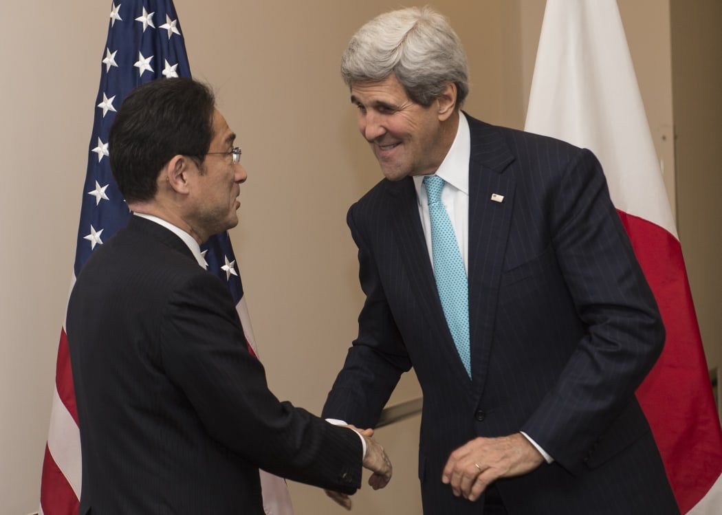 John Kerry (R) and Japanese Foreign Minister Fumio Kishida met on the sidelines of the APEC meeting in Beijing.