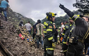 Landslide buries bus in Colombia, killing at least 34