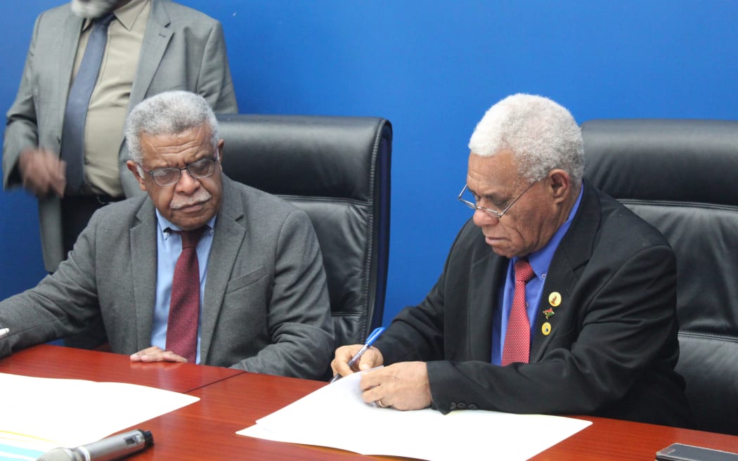 New Caledonia president Louis Mapou and Vanuatu prime minister Bob Loughman exchanging a memorandum of understanding which paves the way for a second submarine cable instalment in New Caledonia.