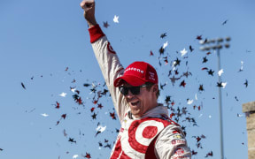 Scott Dixon celebrates his win at the Sonoma Indy Car race.