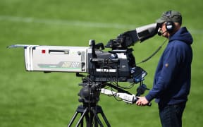 A picture of a Sky cameraman at a rugby match in New Zealand.