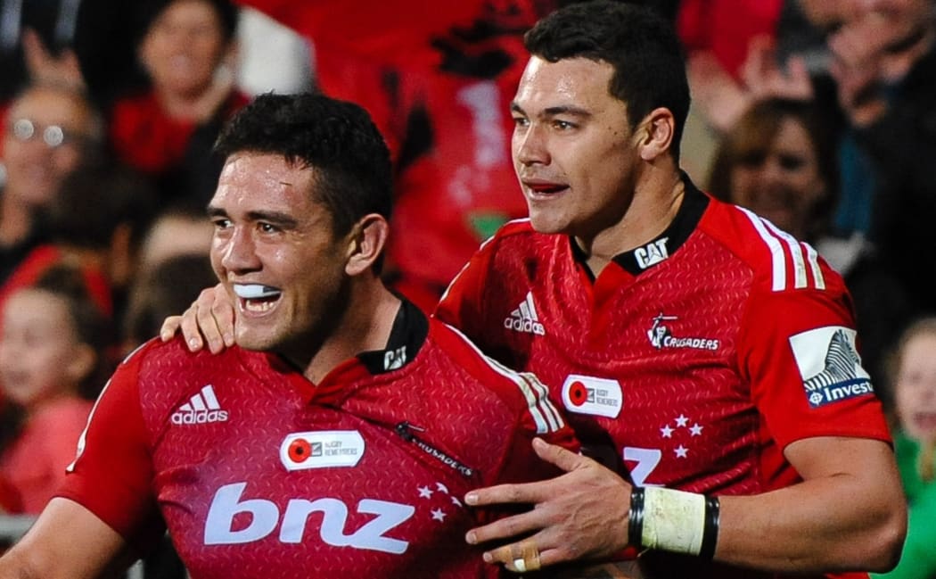 Codie Taylor of the Crusaders celebrates his try with team-mate David Havili.