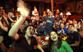 Supporters of the Leave campaign EU referendum in the United Kingdom celebrate to see the lead for them at a pub in London on June 24, 2016.