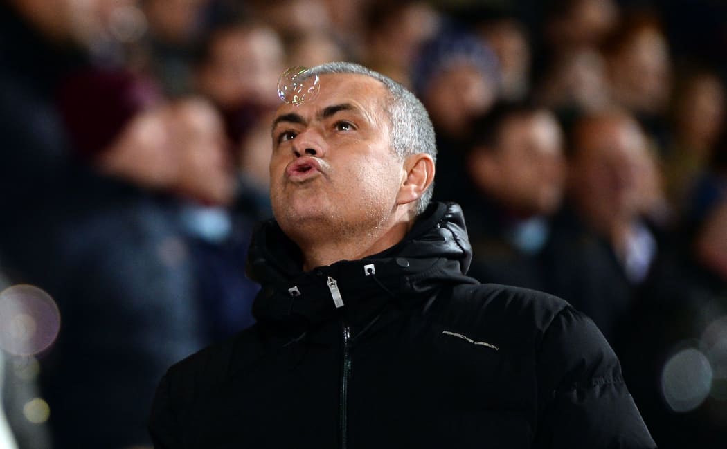 Jose Mourinho, Manager of Chelsea blows away a bubble prior to kick off. 2014.