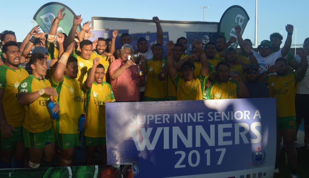 The Eels celebrate winning the inaugural Super 9 rugby title in Samoa, alongside Prime Minister Tuilaepa Sailele Malielegaoi.