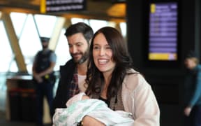 Jacinda Ardern arrives in Wellington with baby Neve and partner Clarke Gayford.