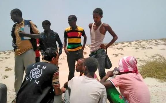 IOM staff assist Somali, Ethiopian migrants who were forced into the sea by smugglers.