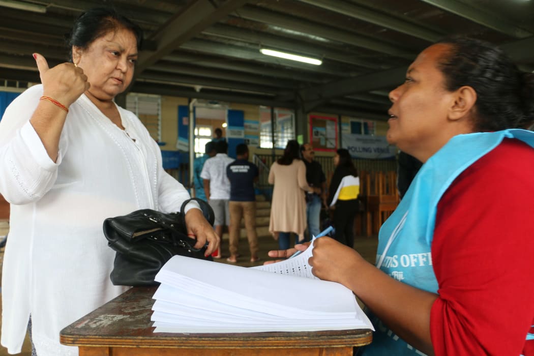A voter in Fiji seeking confirmation about where to vote