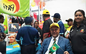 Bulolo MP Sam Basil inside the Pangu Pati's stall at a Political Parties Expo.