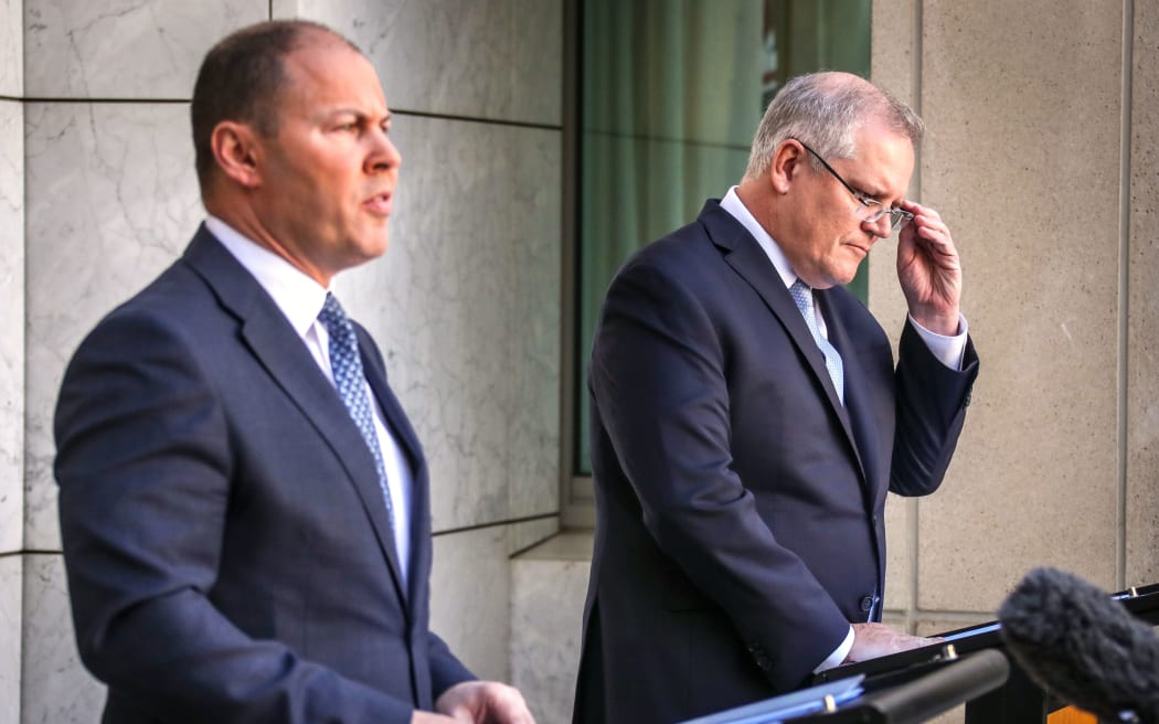 Australian Treasurer Josh Frydenberg, left, and Prime Minister Scott Morrison at a media conference in March 2020.