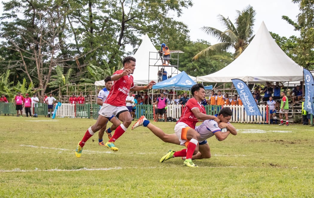 Tonga held off Samoa to qualify for the World Rugby Under 20 Trophy.