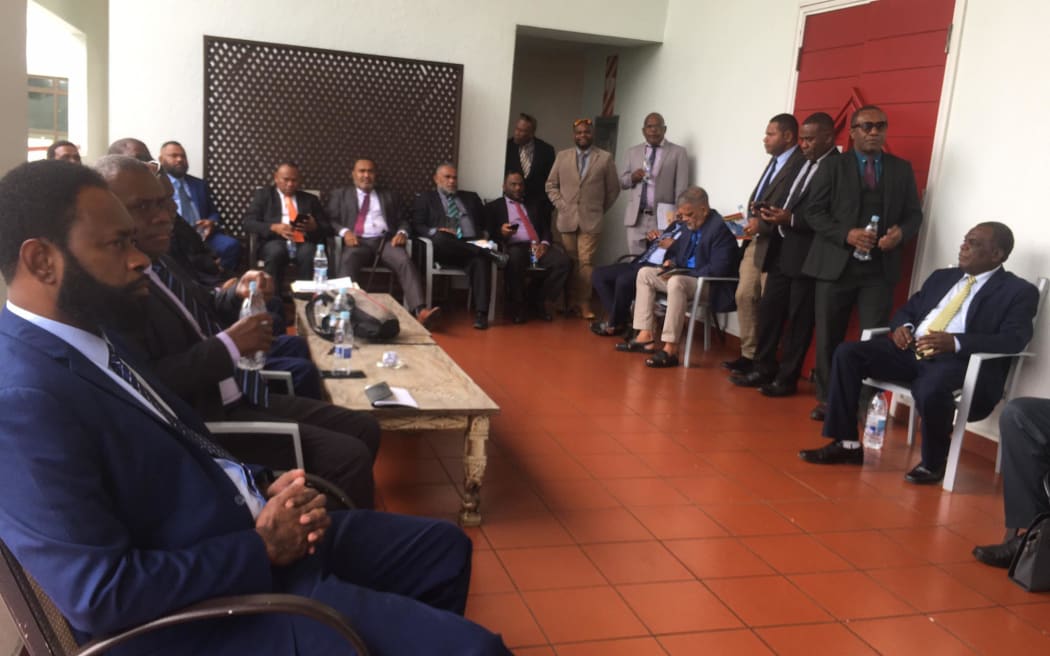 Vanuatu opposition MPs outside parliament chamber on Tuesday morning 