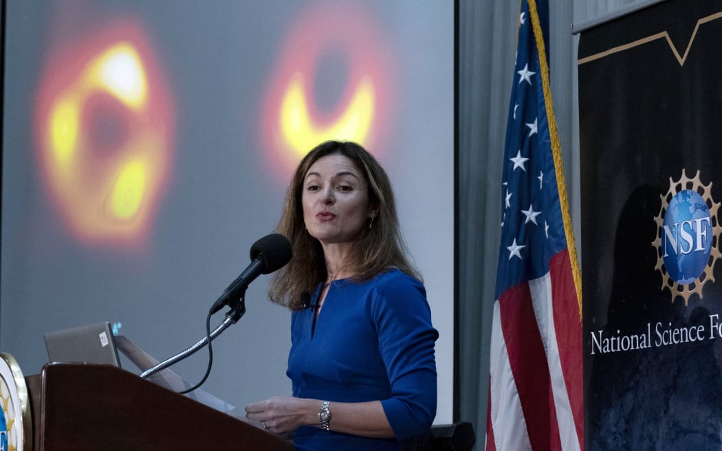 Astronomy and physics professor Ferial Ozil speaks during a press conference to announce the first image of Sagittarius A* (on screen), a supermassive black hole, in the center of the Milky Way, in Washington, D.C., on May 12, 2022.