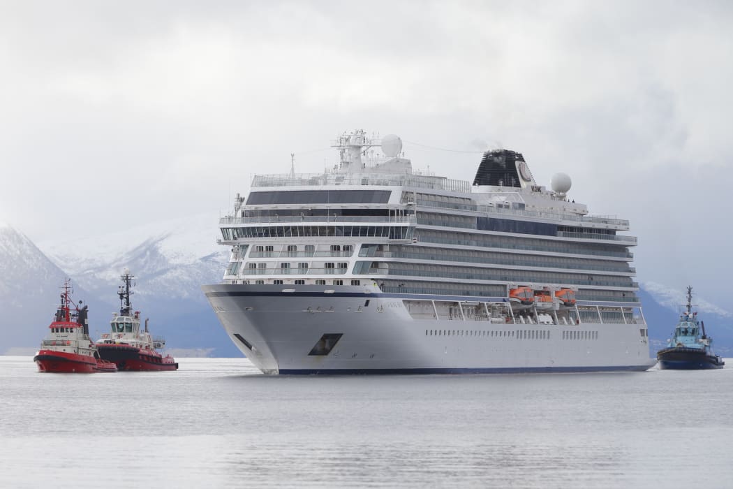 The cruise ship Viking Sky, that ran into trouble in stormy seas off Norway, reaches the port of Molde under its own steam on March 24, 2019.
