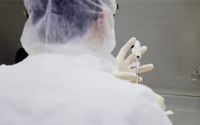 Photo dated December 9, 2020 courtesy of Mount Sinai Health System in New York shows a lab technician during a dry run at Mount Sinai hospital ahead of an expected Pfizer COVID-19 vaccine shipment over the weekend. -