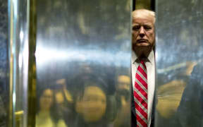 US President Donald Trump boards the elevator at Trump Tower.