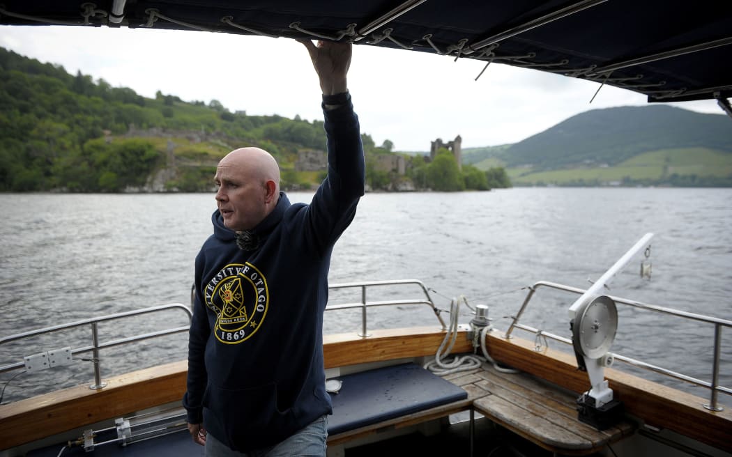Professor Neil Gemmell on his boat as he conducts research into the DNA present in the waters of Loch Ness in the Scottish Highlands, Scotland on June 11, 2018.