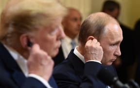 US President Donald Trump and Russia's President Vladimir Putin attend a joint press conference after a meeting at the Presidential Palace in Helsinki, on July 16, 2018.