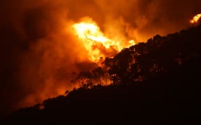 A photo taken on Christmas day of an out-of-control bushfire at Wye River which flared along Victoria's Great Ocean Road.