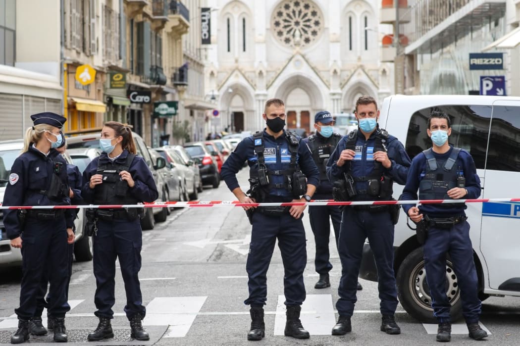 Police block the access to the Notre-Dame de l'Assomption Basilica in Nice on October 29, 2020 after a knife-wielding man kills three people at the church,