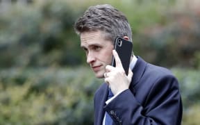File photo of Britain's Defence Secretary Gavin Williamson speaking on a mobile phone as he arrives at 10 Downing Street. He's been sacked over the leak of details of a plan to use Huawei to build the UK's 5G network.