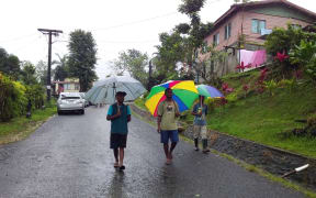 Voters donned gumboots and sheltered under umbrellas to go to cast their vote with heavy rain warning in force.