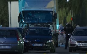 A truck with its windscreen riddled with bullets is seen on a street on July 15, 2016, after it ploughed into a crowd leaving a fireworks display in the French Riviera town of Nice.