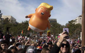 Donald Trump baby balloon at the 4th Women's March LA in Downtown. Los Angeles, January 18, 2020.