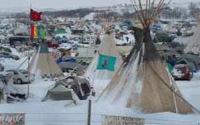 Snow covers Oceti Sakowin Camp near the Standing Rock Sioux Reservation on November 30, 2016 outside Cannon Ball, North Dakota. Native Americans and activists from around the country have been gathering at the camp for several months trying to halt the construction of the Dakota Access Pipeline.