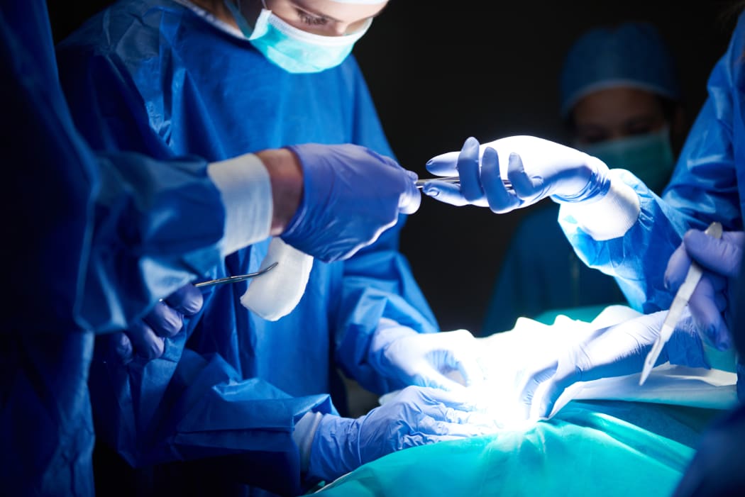Surgery cancellations and delays widespread as hospitals hit by Covid-19, flu | RNZ News