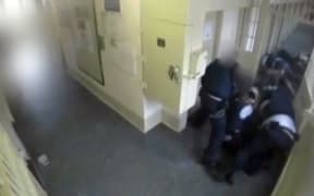 A screenshot from video footage of the attack on Corrections officers at Auckland prison, which led to a mass strip search.