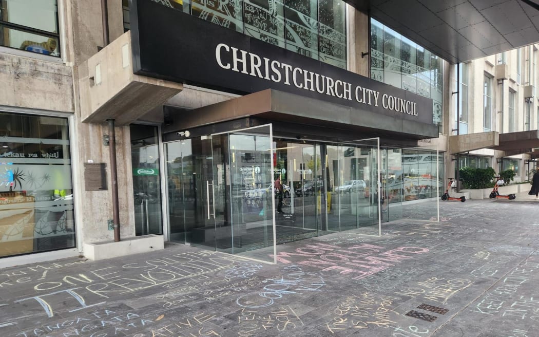 Protesters left chalk messages outside Christchurch City Council.