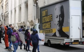 Supporters of WikiLeaks founder Julian Assange demonstrate outside the Central Criminal Court (Old Bailey) after Julian Assange appeared in court for a full extradition hearing on the last day of the trials in London, United Kingdom  Hasan Esen / Anadolu Agency