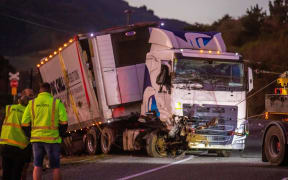 A truck is towed away from the crash scene on SH1, near Picton.