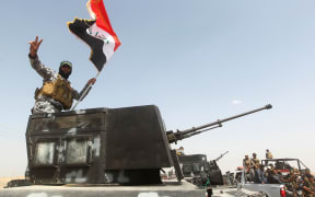 Iraqi security forces and paramilitaries deploy north-west of Baghdad before a major offensive to retake the city of Ramadi from Islamic State.