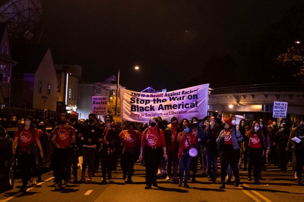 Protesters march through West Philadelphia on October 27, 2020, during a demonstration against the fatal shooting of 27-year-old Walter Wallace, a Black man, by police.