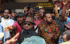 Buchtar Tabuni (centre) returns to Jayapura after a prison term for treason, August 2020.